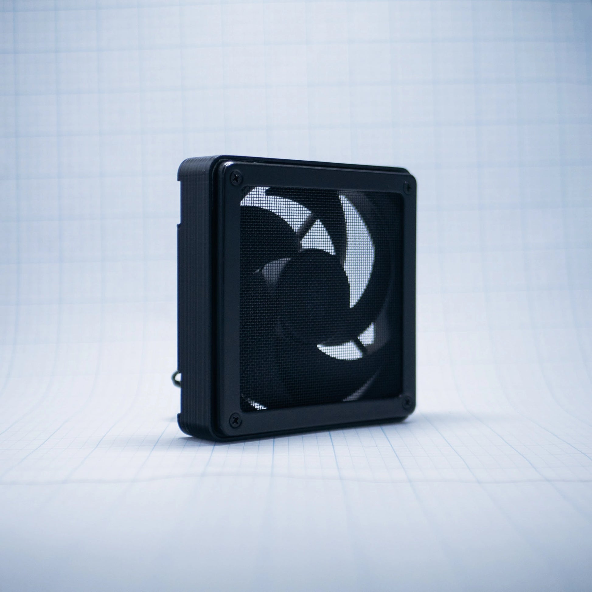 Black with black mesh 120mm Fan Shroud Filter & Outer Cover with an angled front view against white background with grid pattern. 
