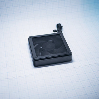 Black shell with black mesh - 120mm Fan Shroud Filter & Outer Cover lying flat against white background with grid pattern. 