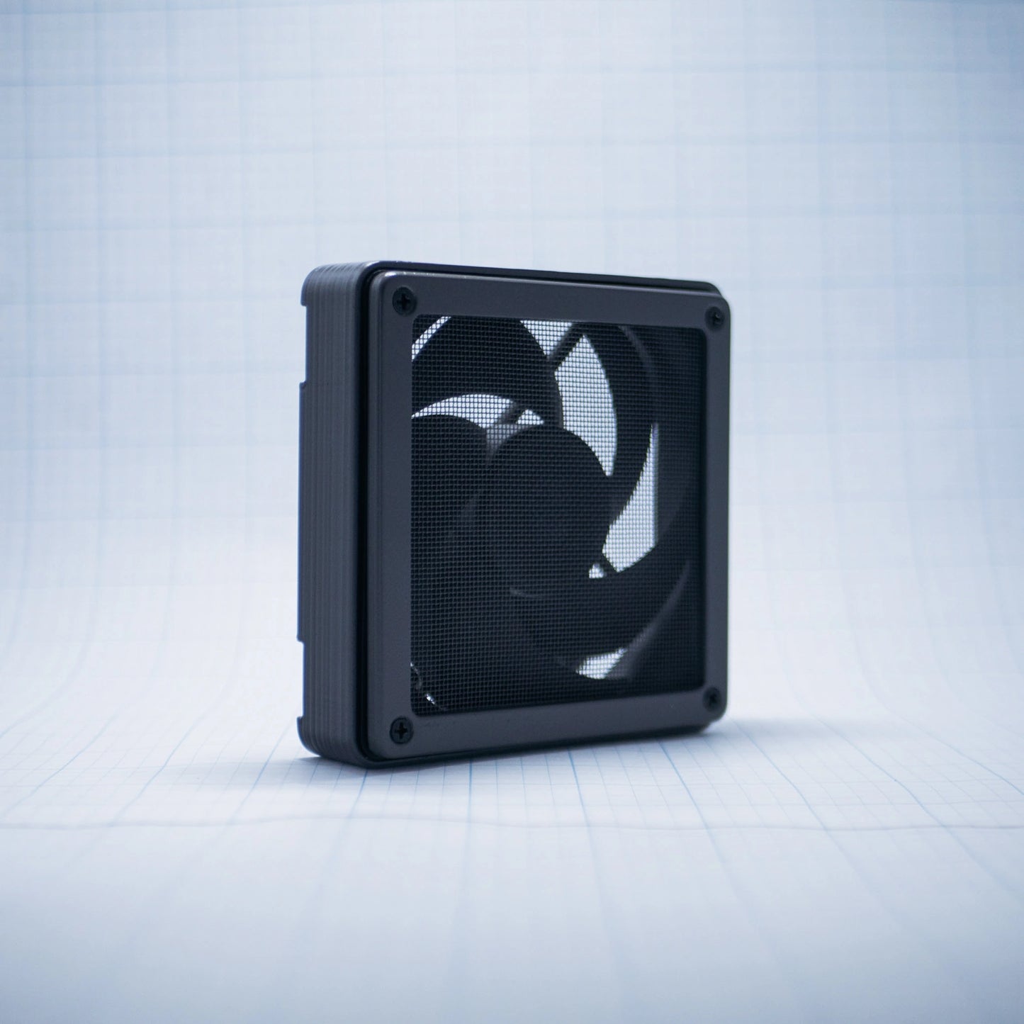 Charcoal gray with Charcoal gray 120mm Fan Shroud Filter & Outer Cover with an angled front view against white background with grid pattern. 