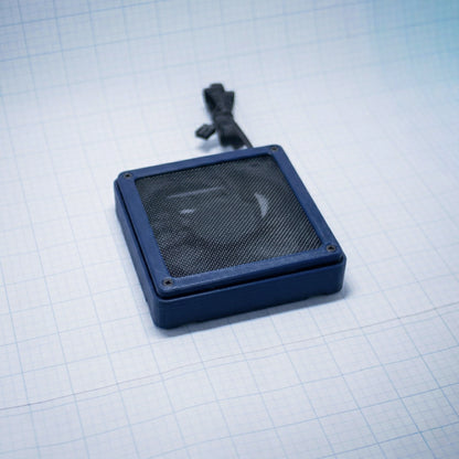 Navy Blue shell with navy blue mesh- 120mm Fan Shroud Filter & Outer Cover lying flat against white background with grid pattern. 