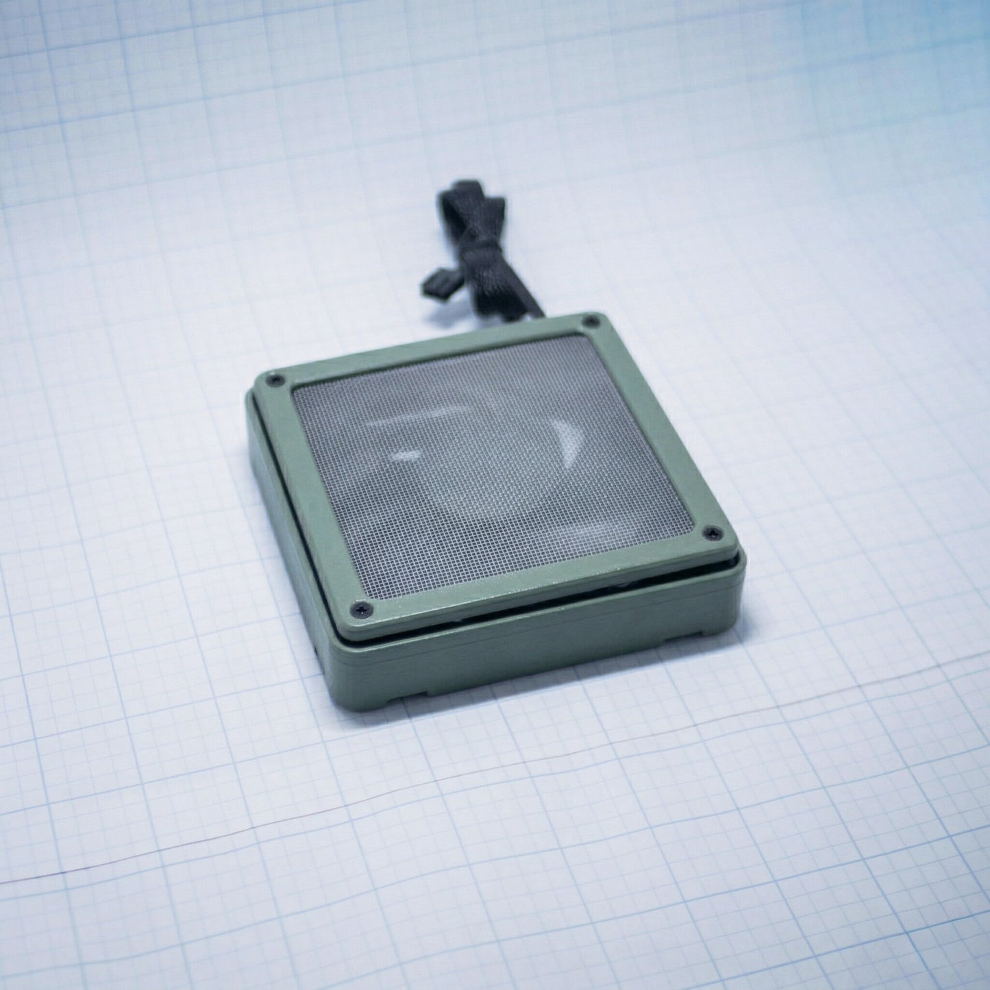 Sage Green shell with raw steel mesh - 120mm Fan Shroud Filter & Outer Cover lying flat against white background with grid pattern. 
