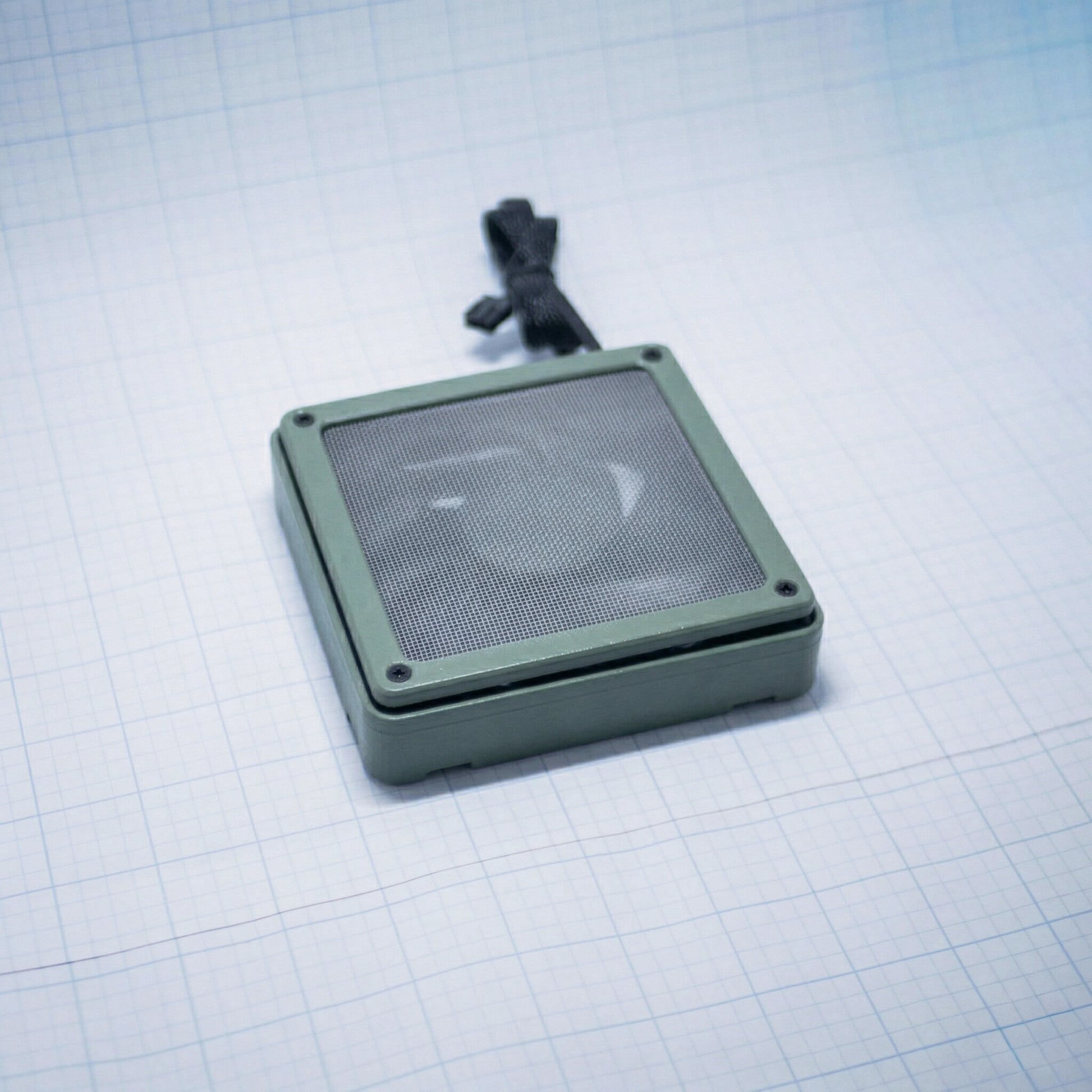 Sage Green shell with raw steel mesh - 120mm Fan Shroud Filter & Outer Cover lying flat against white background with grid pattern. 