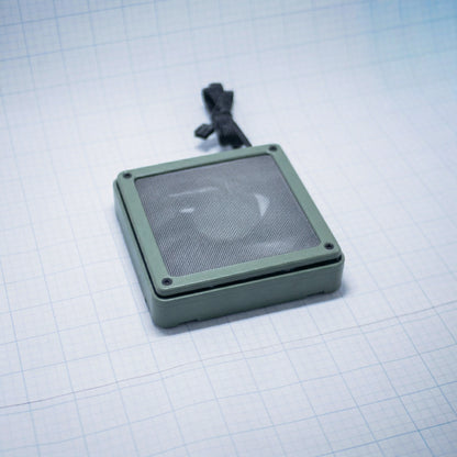 Sage Green shell with raw steel mesh - 120mm Fan Shroud Filter & Outer Cover lying flat against white background with grid pattern. 