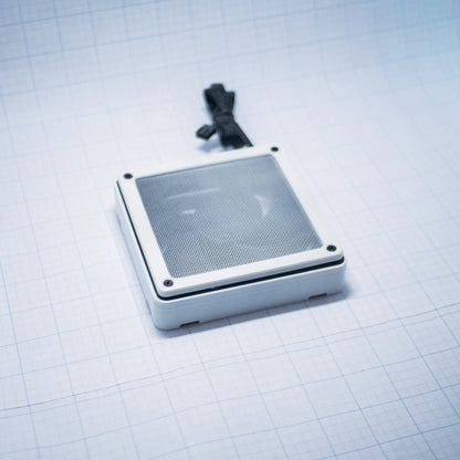 White shell with white mesh - 120mm Fan Shroud Filter & Outer Cover lying flat against white background with grid pattern. 