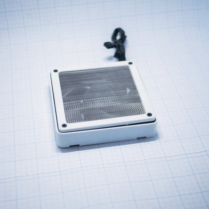 White shell with raw steel mesh - 120mm Fan Shroud Filter & Outer Cover lying flat against white background with grid pattern. 