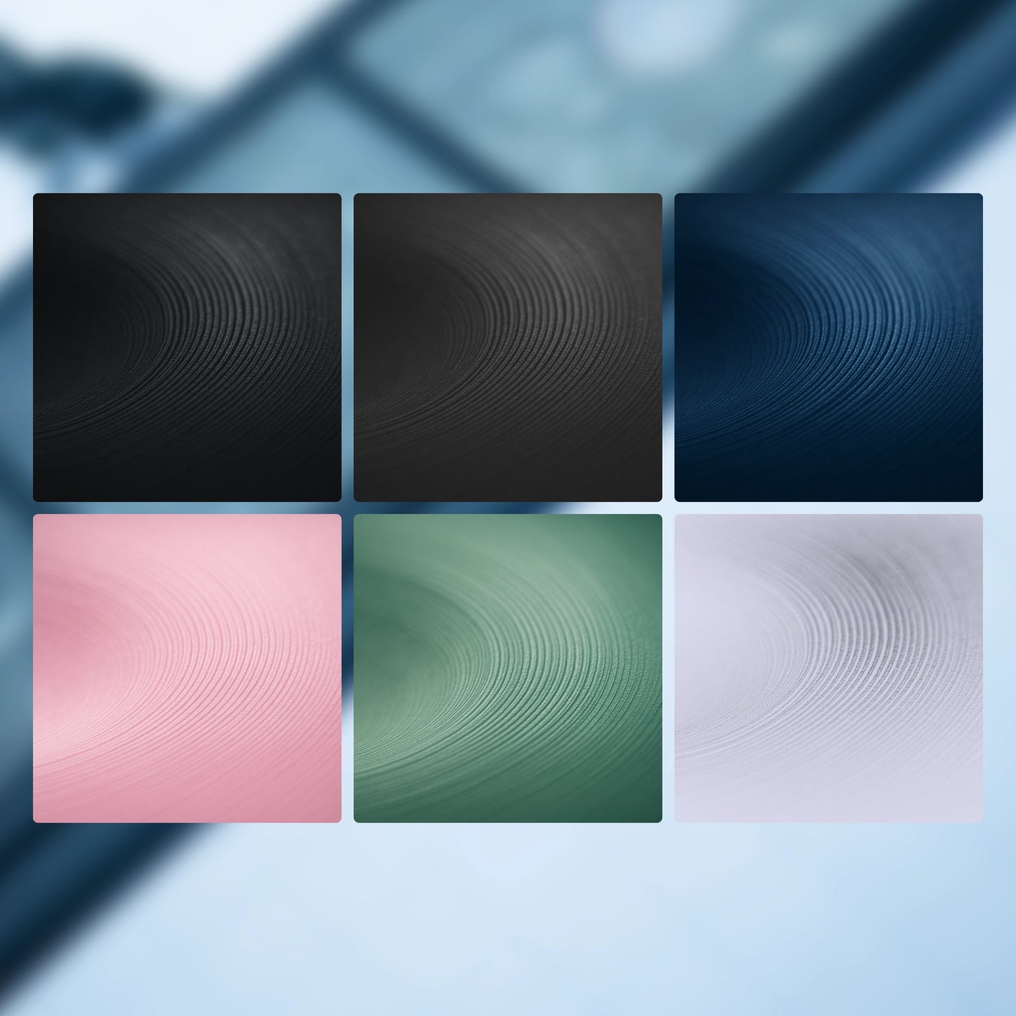 Six square tiles with wavy line patterns in black, pink, green, and blue on a blurred abstract background.